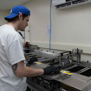 lab-staff-14 A Chadwick Optical staff member manages a the ultrasonic cleaning process.